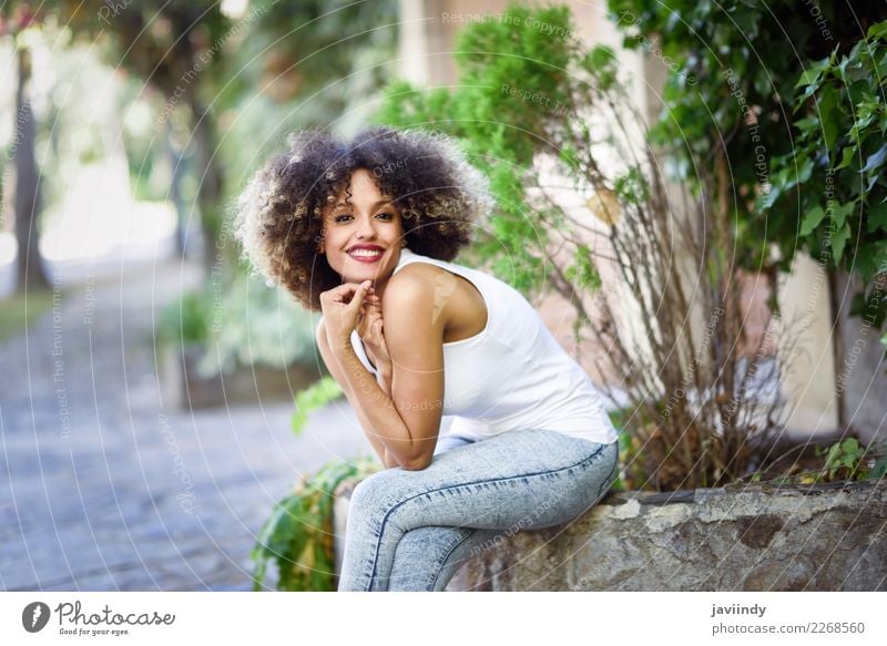 Young black woman with afro hairstyle smiling in urban park Lifestyle Style Beautiful Hair and hairstyles Summer Human being Feminine Young woman