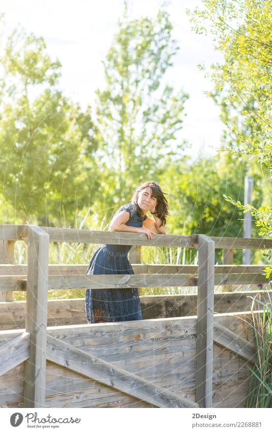 Portrait of a sensual woman on a wooden bridge Lifestyle Elegant Style Beautiful Vacation & Travel Summer Human being Woman Adults Nature Sky River Bridge