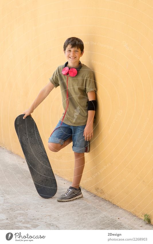 A Teen with skateboard on the city street Lifestyle Style Joy Happy Sports Schoolchild Human being Boy (child) Man Adults Infancy Street Fashion Jeans Smiling