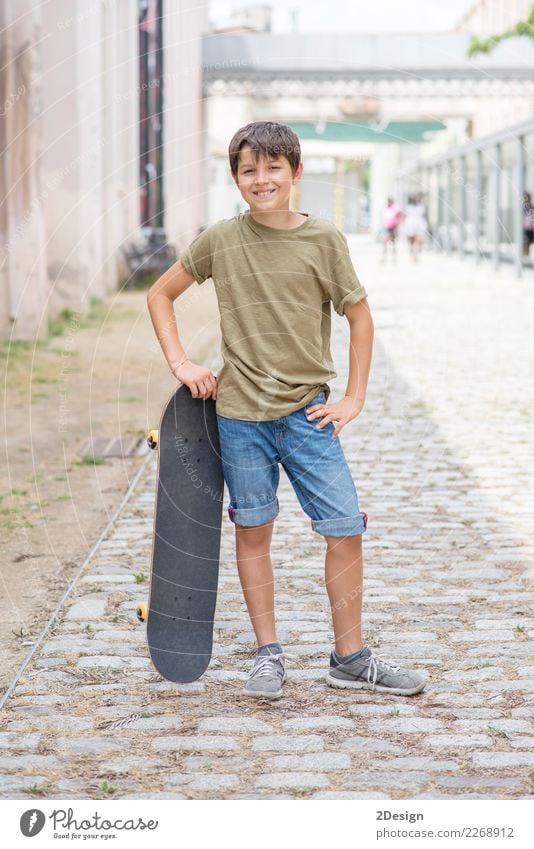 Close-up of a teenage boy carrying skateboard and smiling Lifestyle Leisure and hobbies Vacation & Travel Summer Young man Youth (Young adults) Man Adults