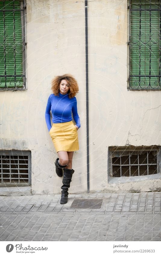 Afroamerican woman in urban street. Afro hairstyle. Lifestyle Elegant Style Beautiful Hair and hairstyles Face Human being Feminine Young woman