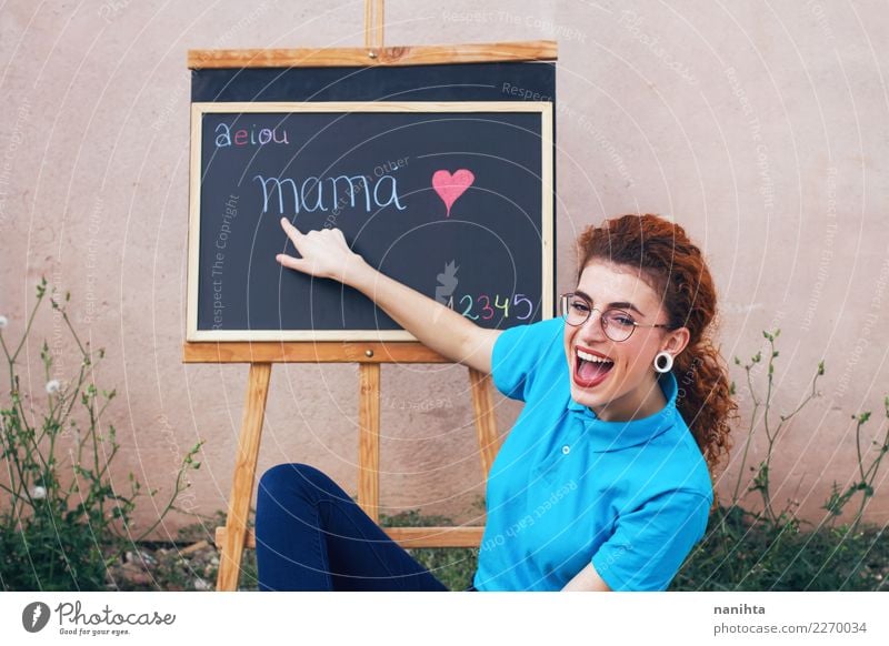 Young teacher in a school lesson Lifestyle Joy Beautiful Parenting Education Kindergarten School Classroom Blackboard Teacher Work and employment Profession