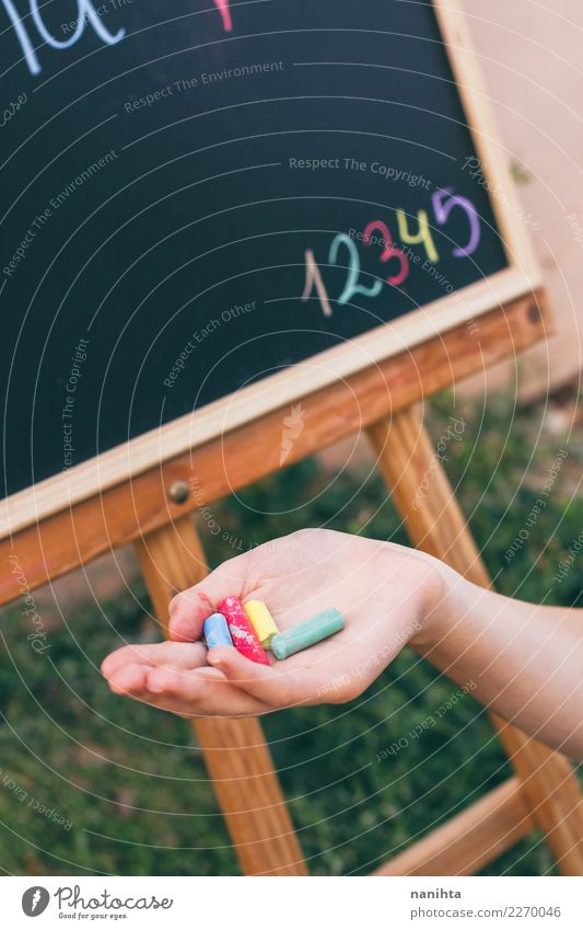 Hand holding chalks in a school lesson Lifestyle Design Leisure and hobbies Parenting Education Kindergarten School Blackboard Schoolchild Student Teacher