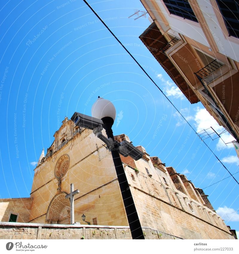 God sees you here, too. Sky Summer Beautiful weather Warmth Small Town Old town Church Manmade structures Wall (barrier) Wall (building) Facade