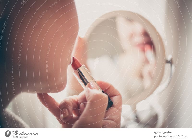 woman putting on lipstick in the mirror Human being Feminine 1 Esthetic Emotions Red Woman Colour Girl Mirror image Reflection Lipstick Colour photo