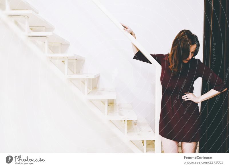 Woman in burgundy dress standing right on stairs Feminine Young woman Youth (Young adults) Adults 1 Human being 18 - 30 years Emotions Crisis Pain Withdrawn