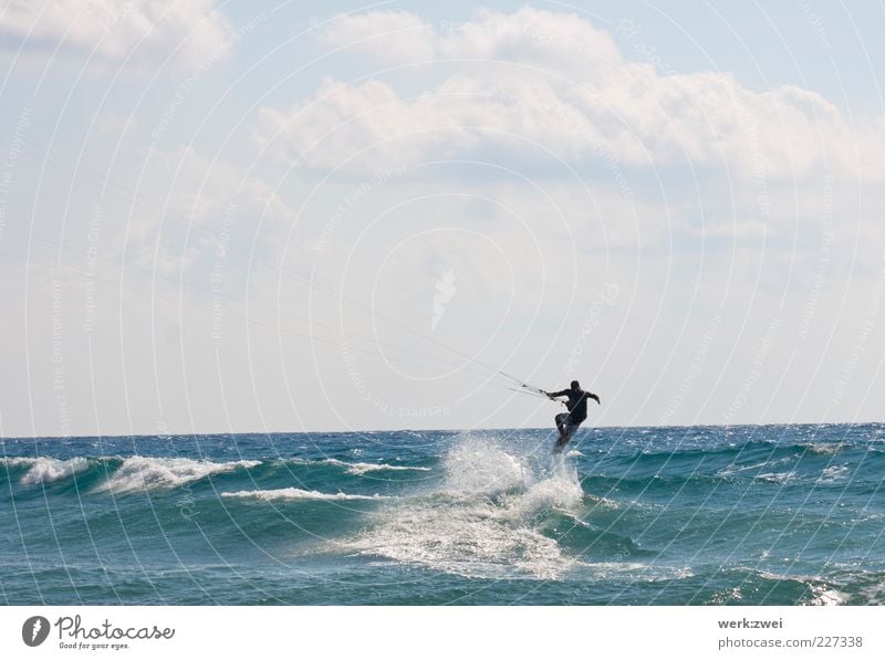 surfing Aquatics Sportsperson Kiteboard Ocean Masculine 1 Human being Environment Water Drops of water Sky Clouds Horizon Sunlight Summer Beautiful weather