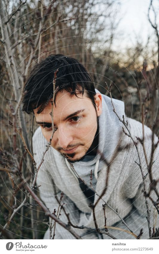 Young man between branches at winter Lifestyle Style Harmonious Calm Adventure Freedom Expedition Human being Masculine Youth (Young adults) 1 30 - 45 years