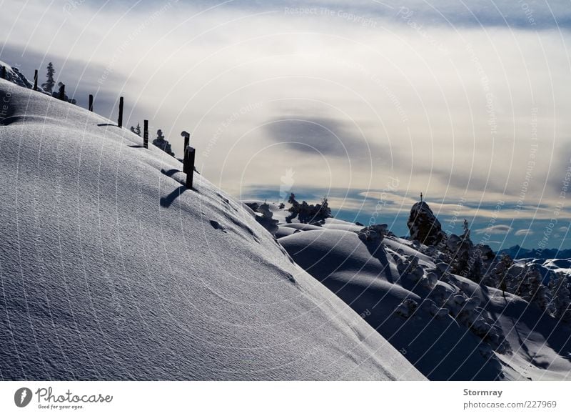 Light and shadow Winter Snow Winter vacation Mountain Ski run Nature Landscape Sky Clouds Sunlight Weather Ice Frost Alps Snowcapped peak Freeze Cold Blue Black