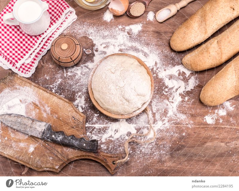 wheat yeast dough for bread Dough Baked goods Bread Roll Bowl Table Kitchen Wood Fresh Natural Brown White Yeast background Preparation food healthy Ingredients