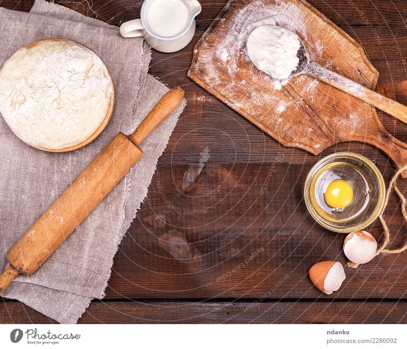 yeast dough in a wooden bowl Dough Baked goods Bread Bowl Spoon Table Kitchen Wood Fresh Natural Brown White Rolling pin Yeast background Preparation food