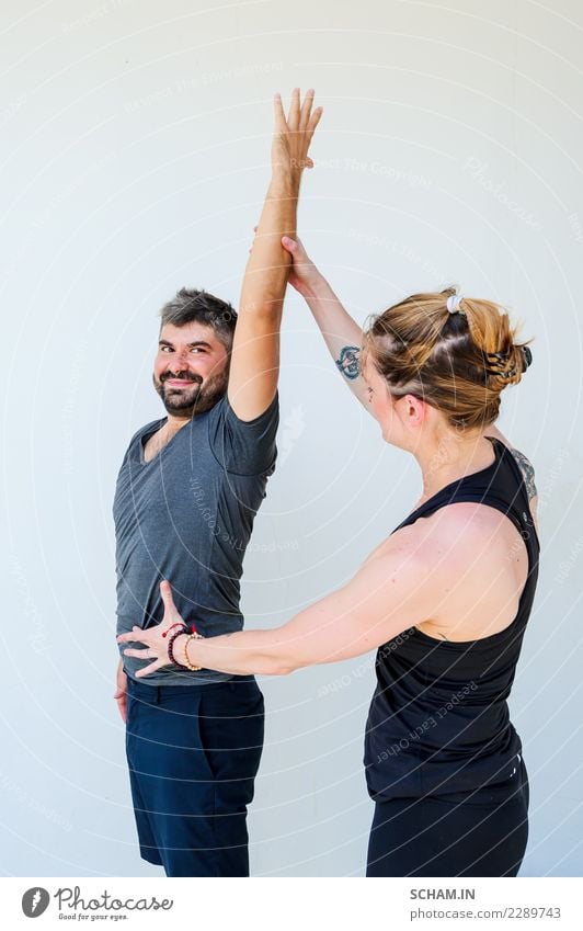 Yoga students showing different yoga poses and helping each other do it the right way. Lifestyle Health care Relaxation Calm Meditation Sports Human being