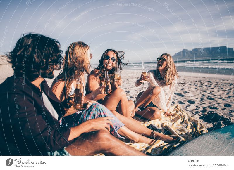 Group of friends having drinks on the beach in South Africa Drinking Beer Joy Happy Vacation & Travel Beach Party Friendship Sand Sunglasses Smiling Sit