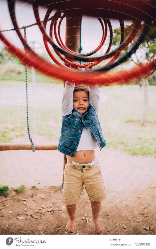 Cute toddler boy having fun playing on playground Lifestyle Joy Relaxation Leisure and hobbies Child Toddler Boy (child) Infancy Park Playground Hanging