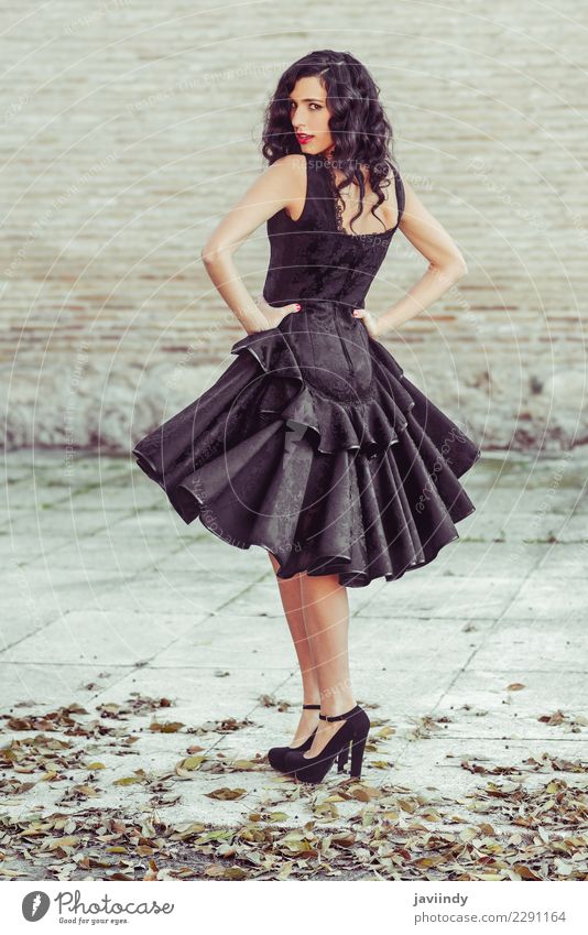 Woman wearing black dress with wavy hair. Spanish style Elegant Style Beautiful Hair and hairstyles Skin Face Human being Feminine Young woman