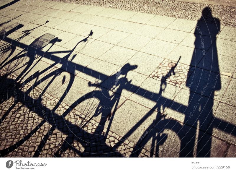 Shadow-I Leisure and hobbies Bicycle Human being 1 Dark Bright Handrail Sidewalk Footpath Take a photo Shadow play Shadow child Colour photo Exterior shot