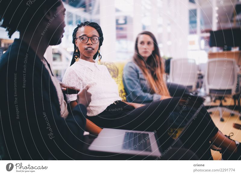 Group of young adults having a meeting in the office Internship Work and employment Office Business Meeting To talk Computer Notebook Technology Driving