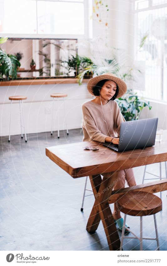 Young asian adult working on laptop in cafe Shopping Work and employment Financial Industry Business Computer Notebook Technology Woman Adults Email Communicate