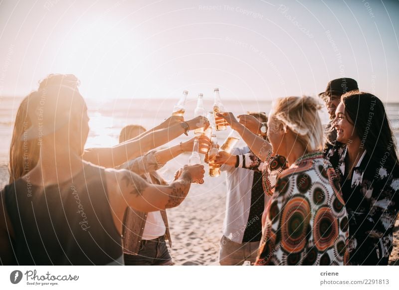 Group of young adult friends cheering with beers on beach Beverage Drinking Alcoholic drinks Beer Bottle Lifestyle Vacation & Travel Summer Beach Music