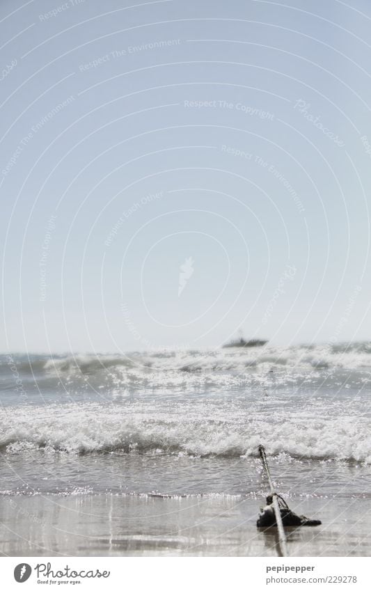 on the long line Far-off places Summer Summer vacation Beach Ocean Waves Rope Sand Water Sky Horizon Sun Beautiful weather Coast Sport boats Yacht Motorboat