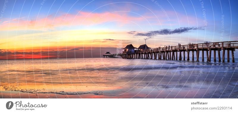 Naples Pier on the beach at sunset in Naples, Florida, USA Vacation & Travel Beach Ocean Nature Landscape Coast Fishing village Small Town Concrete Water Blue