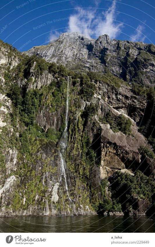 water if Nature Elements Air Water Sky Clouds Plant Tree Rock Mountain Bay Fjord Waterfall Tall Blue Green Uniqueness Vacation & Travel Milford Sound