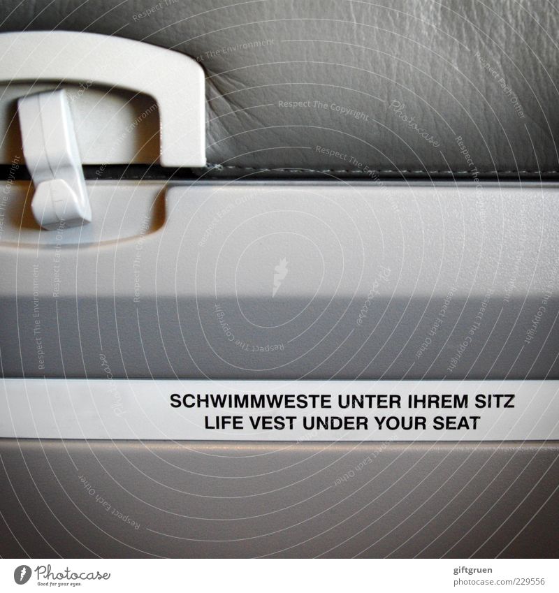 don't inflate your vest while inside the aircraft Means of transport Passenger traffic Airplane Passenger plane In the plane Fear of death Safety Precuation