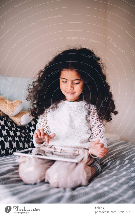 Little african girl playing game on digital tablet at home Happy Beautiful Playing Child School Computer Technology Internet Human being Infancy Smiling Small