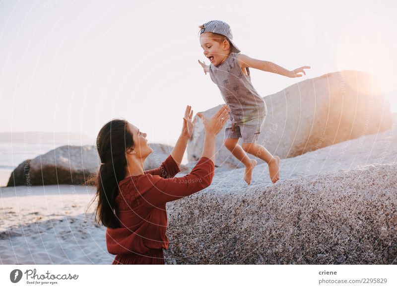 Happy mother and son having fun on beach on vacation Lifestyle Joy Beautiful Leisure and hobbies Playing Vacation & Travel Summer Sun Beach Ocean Child Toddler