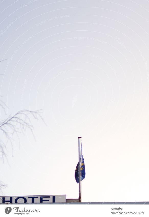 HOTEL Building Roof Characters Hotel Flag Flagpole Sky Blue Branch Colour photo Exterior shot Copy Space top Day Sunlight Cloudless sky Twilight