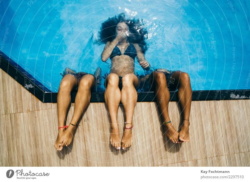 Three young women diving in the pool Lifestyle Joy Happy Swimming pool Swimming & Bathing Leisure and hobbies Vacation & Travel Tourism Summer Summer vacation