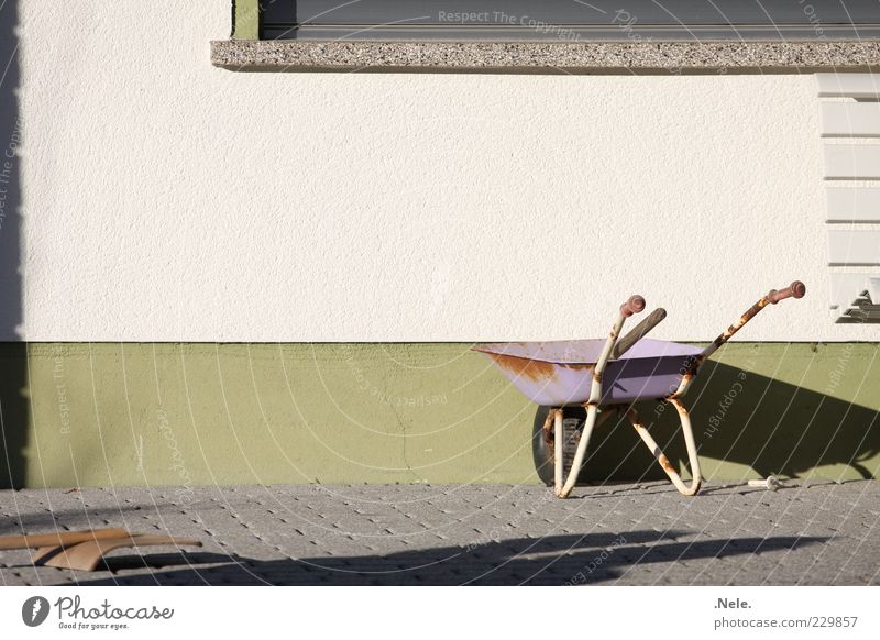 Child labor. Playing Wheelbarrow Wall (building) Stone Old Natural Brown Green Violet White Emotions Orderliness Boredom Comfortable Nostalgia Past