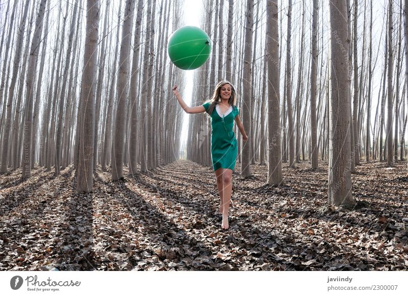 Blonde girl with green balloon and dress in the forest Lifestyle Joy Beautiful Relaxation Human being Young woman Youth (Young adults) Woman Adults 1