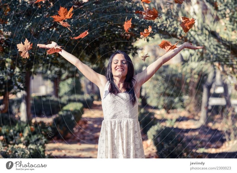 Beautiful girl with falling leaves in the autumn Lifestyle Joy Happy Relaxation Leisure and hobbies Winter Human being Feminine Young woman Youth (Young adults)