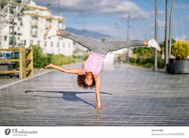 Black fit woman doing fitness acrobatics in the street Lifestyle Beautiful Body Hair and hairstyles Leisure and hobbies Sports Human being Young woman