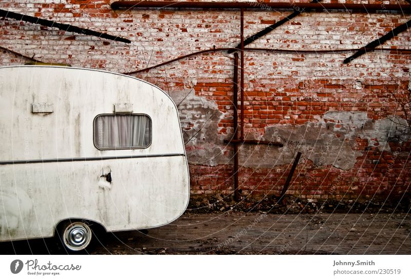 Two-wheeled flat. Deserted Wall (barrier) Wall (building) Facade Caravan Stone Old Broken Calm Poverty Colour photo Exterior shot Day Central perspective Dirty