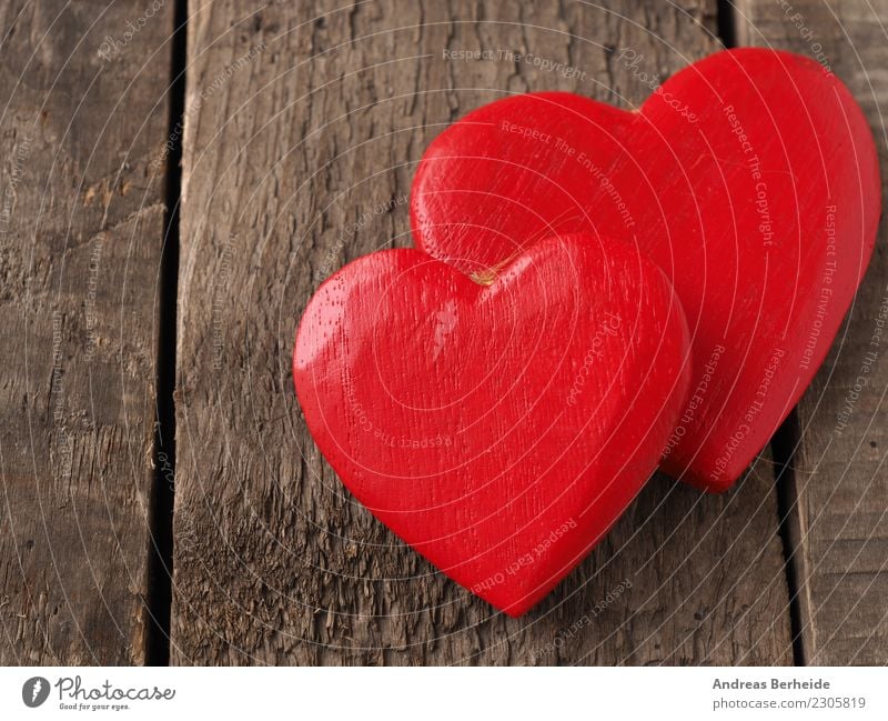 Two red wooden hearts on a wooden table Valentine's Day Wedding Wood Heart Love Retro Sympathy Friendship Together Background picture blackboard card chalkboard