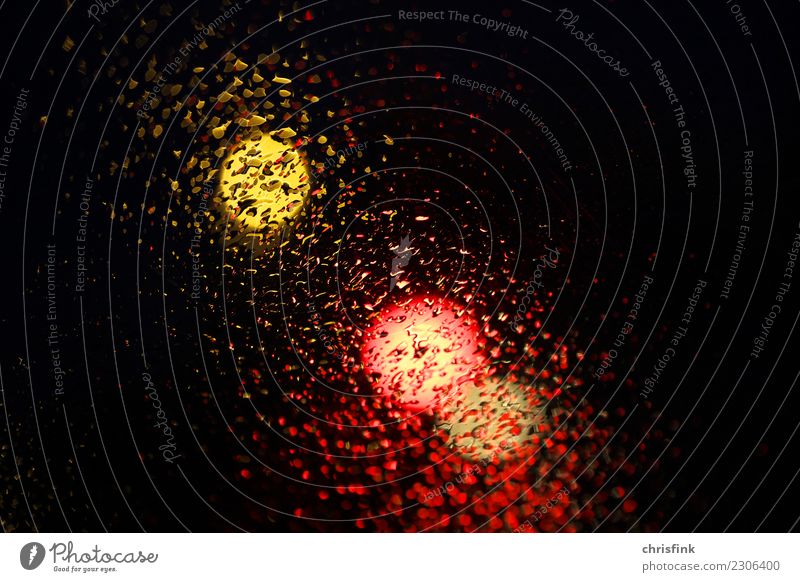 Traffic light behind disc with drops Drops of water Sky Rain Road traffic Motoring Traffic accident Driving Wet Gold Orange Black Fear Threat Colour photo