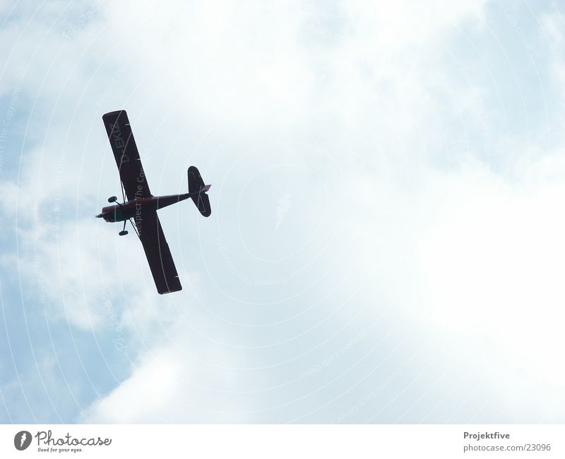 Airplane in the sky Clouds Back-light Crate Wing Darken Aircraft Machinery Span Passenger plane Celestial bodies and the universe Aviation Sky Summer cessna