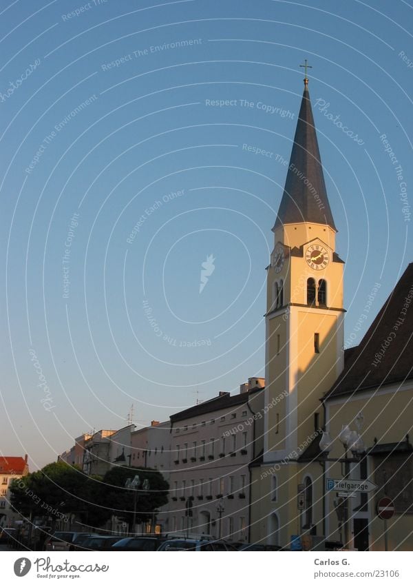 Church in the evening House of worship Religion and faith Evening mill village Church spire Pointed roof Christian cross Church tower clock Housefront Blue sky