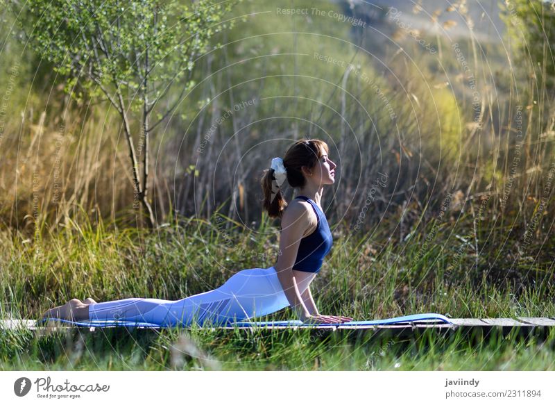 Young woman doing yoga in nature. Lifestyle Beautiful Body Relaxation Meditation Summer Sports Yoga Human being Youth (Young adults) Woman Adults 1