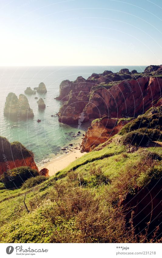 ode to the sun. Lagos Coast Rock Rocky coastline Beach Idyllic beach Sand Bay Cliff Vacation & Travel Algarve Portugal Vacation photo Ocean Atlantic Ocean