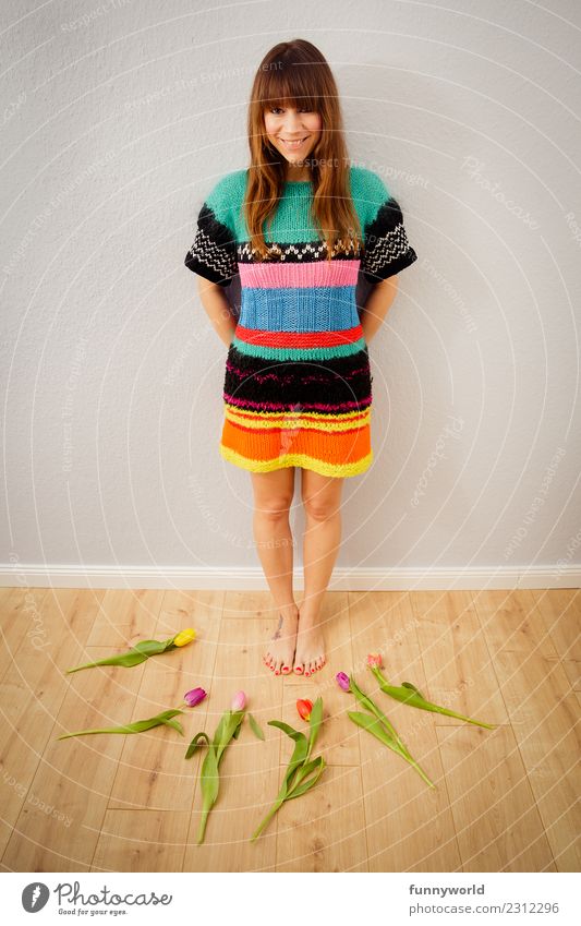 Smiling woman surrounded by tulips Human being Feminine Woman Adults 1 Brunette Bangs Blossoming Lie Wait Happiness Fresh Healthy Happy Natural Joy Tulip Stand