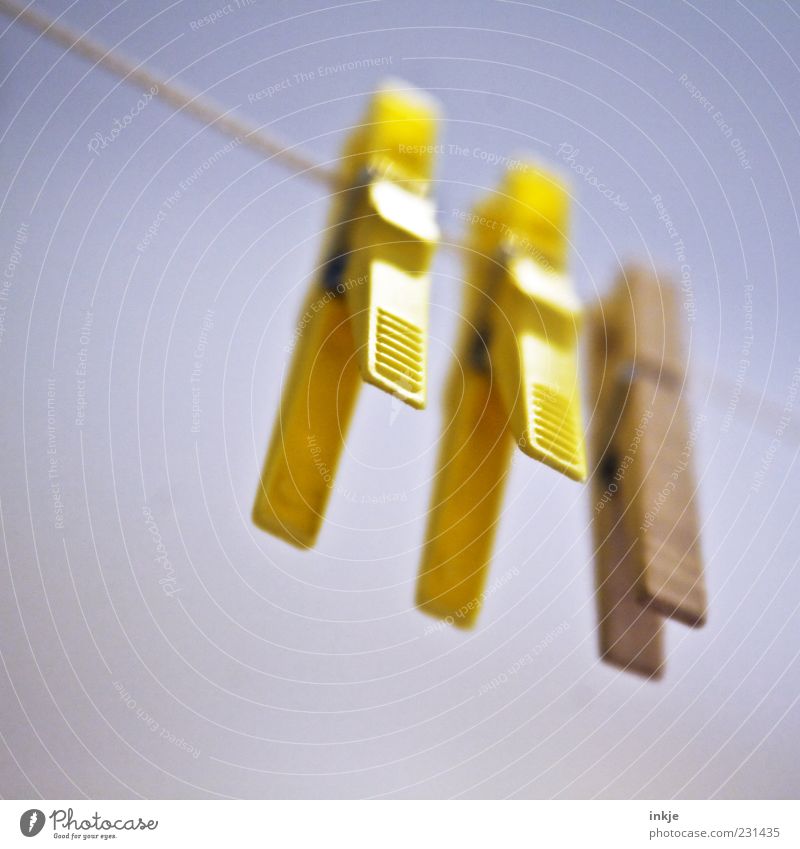 always ready Clothes peg Clothesline Plastic Hang Yellow Photos of everyday life Colour photo Exterior shot Close-up Detail Deserted Copy Space left