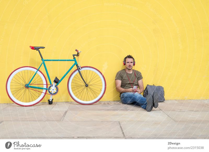 Young man wearing sunglasses relaxing on the floor Lifestyle Joy Happy Relaxation Leisure and hobbies Music Work and employment Computer Notebook Technology