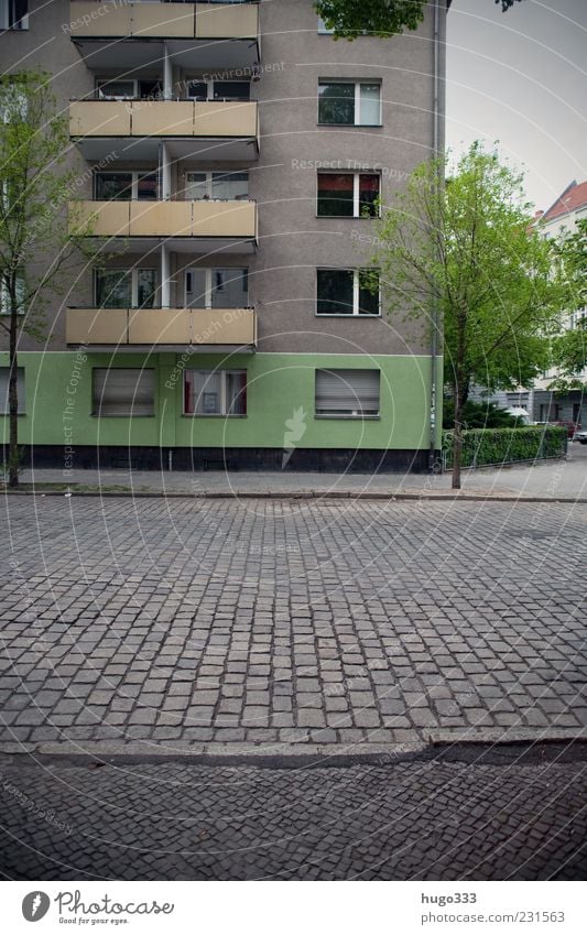 Berlin XI Neukölln Town Capital city Deserted Balcony Traffic infrastructure Street Stone Gray Green Roller shutter Hedge Paving stone Curbside New building