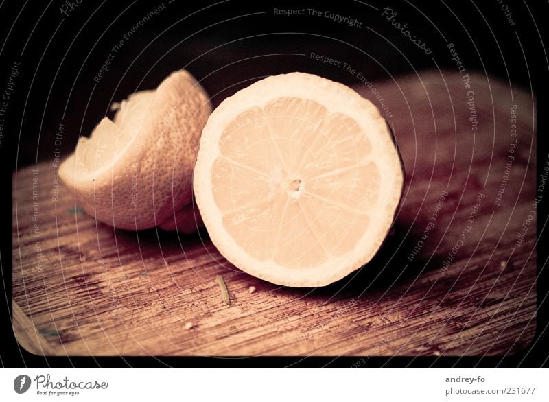 lemon Wood Lie Fresh Delicious Sour Brown Yellow Lemon yellow Lemon peel Chopping board Cut Fruit Nutrition Lime Lime peel Close-up Colour photo Interior shot