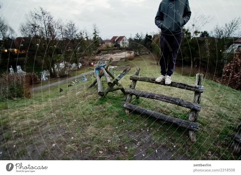 sweetbread Man Human being Youth (Young adults) Young man Stand Balance Mountaineer Climbing facility Joist Wood Hill Playground Copy Space Loneliness Gloomy