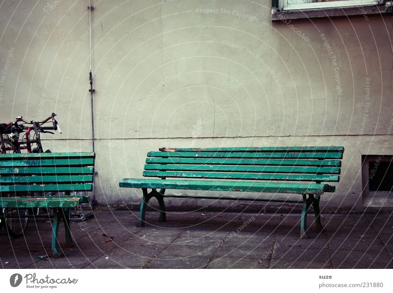 House and courtyard bank Places Facade Wait Old Authentic Gloomy Dry Gray Green Loneliness Past Bench Wooden bench Paving tiles Wall (building) Stone path