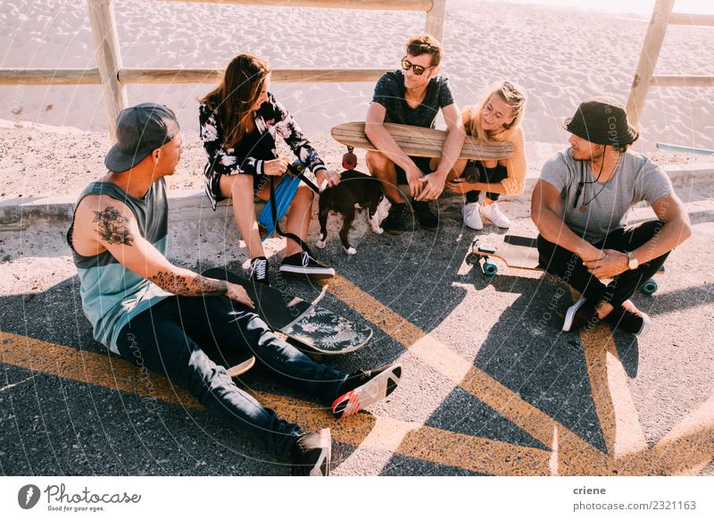 Group of hipster friends hanging out at beach with skateboards Lifestyle Joy Happy Leisure and hobbies Vacation & Travel Summer Sunbathing Beach Ocean Woman